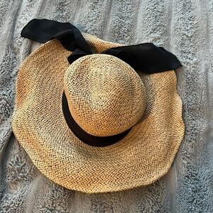 Beautiful sun hat with black bow. Like new.